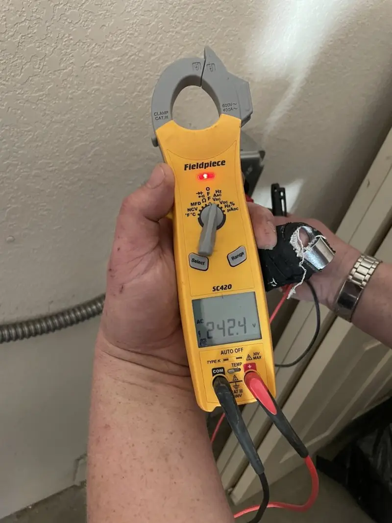 Voltage testing with clamp meter during Hot Tub / Pool Electrical Wiring in Spring Arbor